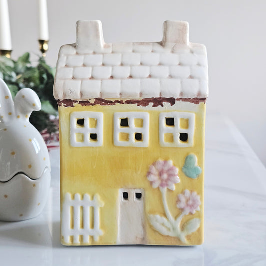 yellow Ceramic  led house-shaped decoration with yellow body, white roof, and floral details 