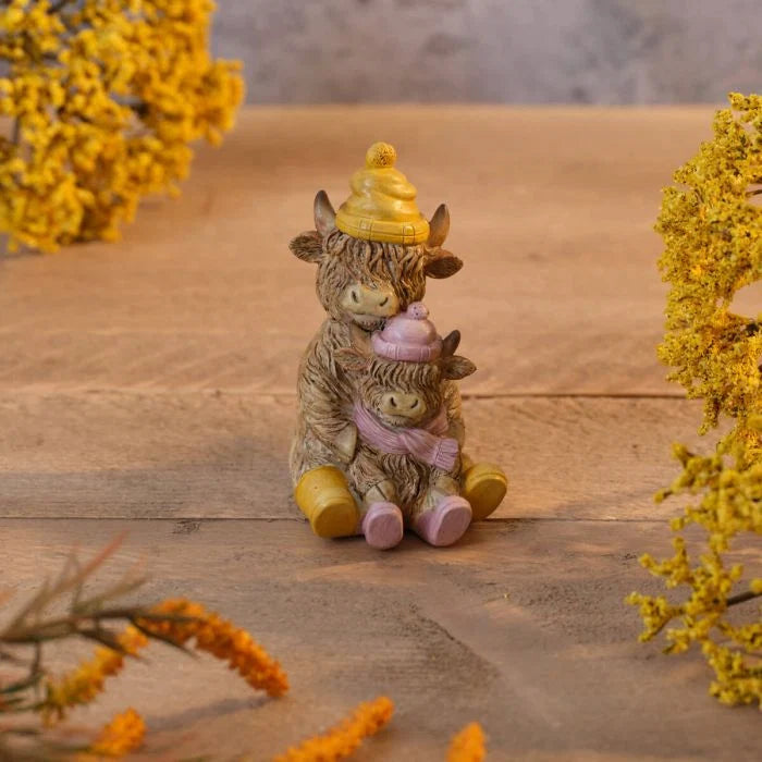 Highland cow resin double raincoat family ornament with two cows wearing matching coats