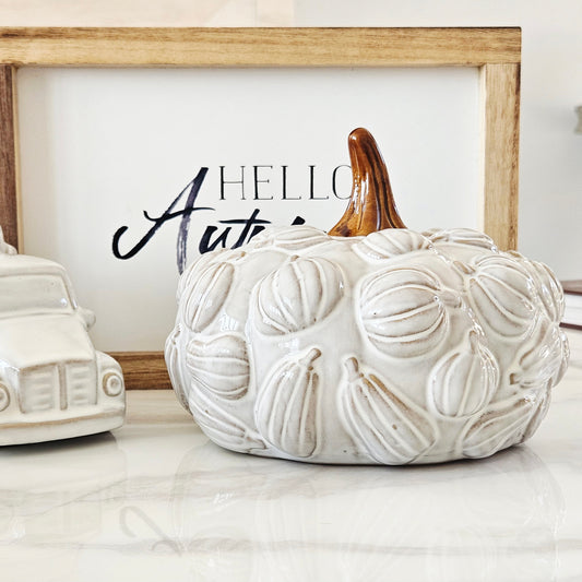 White textured ceramic pumpkin with brown stem and 3d pumpkins all over it 19cm