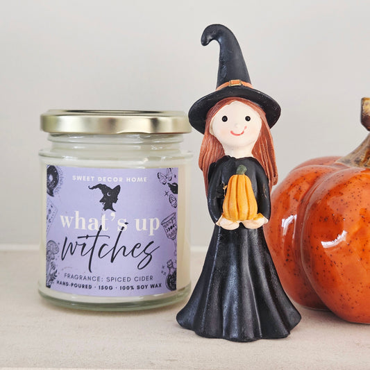 Halloween girl witch holding squash decoration