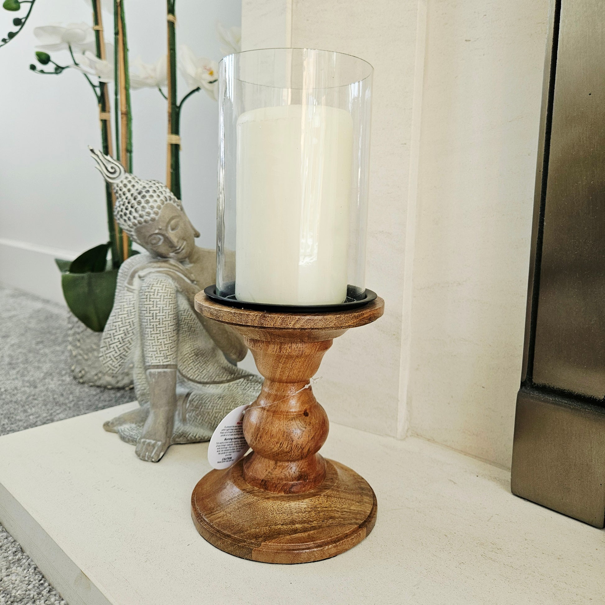 Candle in a wooden stand with a glass holder 