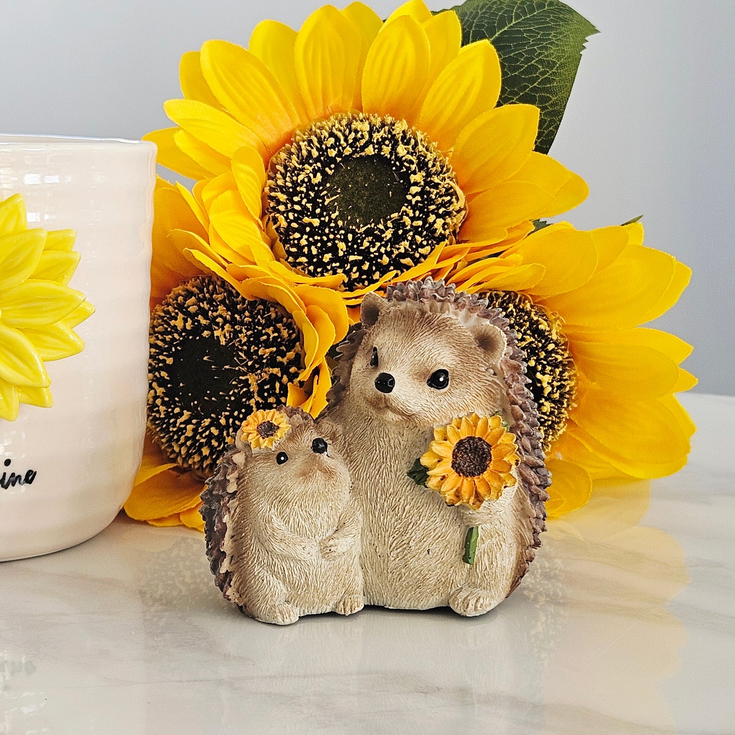 Decorative hedgehog mum and baby figurines with sunflowers 