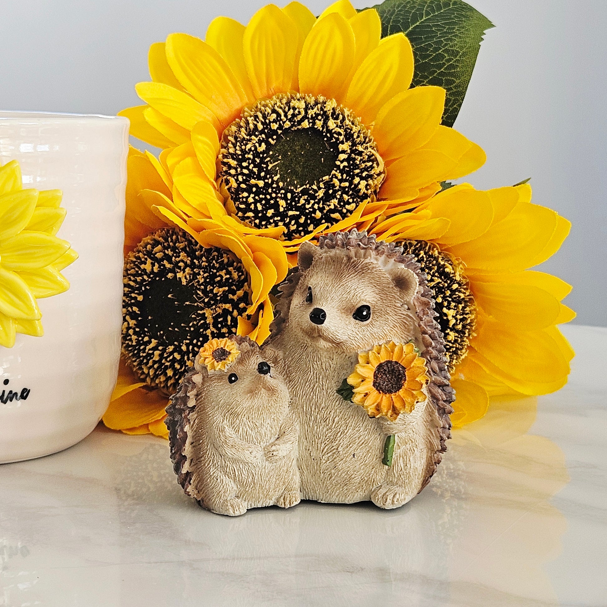 Decorative hedgehog mum and baby figurines with sunflowers 
