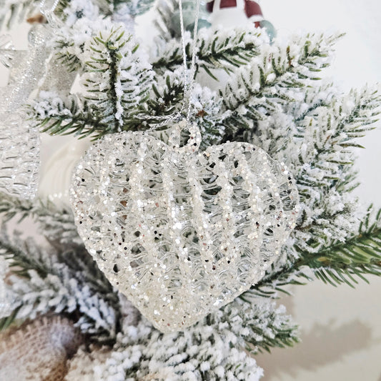 A heart-shaped silver glass glitter ornament  Christmas tree decoration