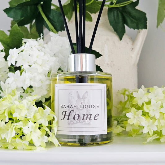 Diffuser bottle labeled 'Sarah Louise Home'with rabbits black lily scent 150ml