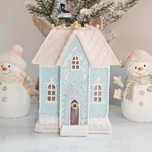 Pastel blue Christmas house ornament with peaked roof and arched windows led