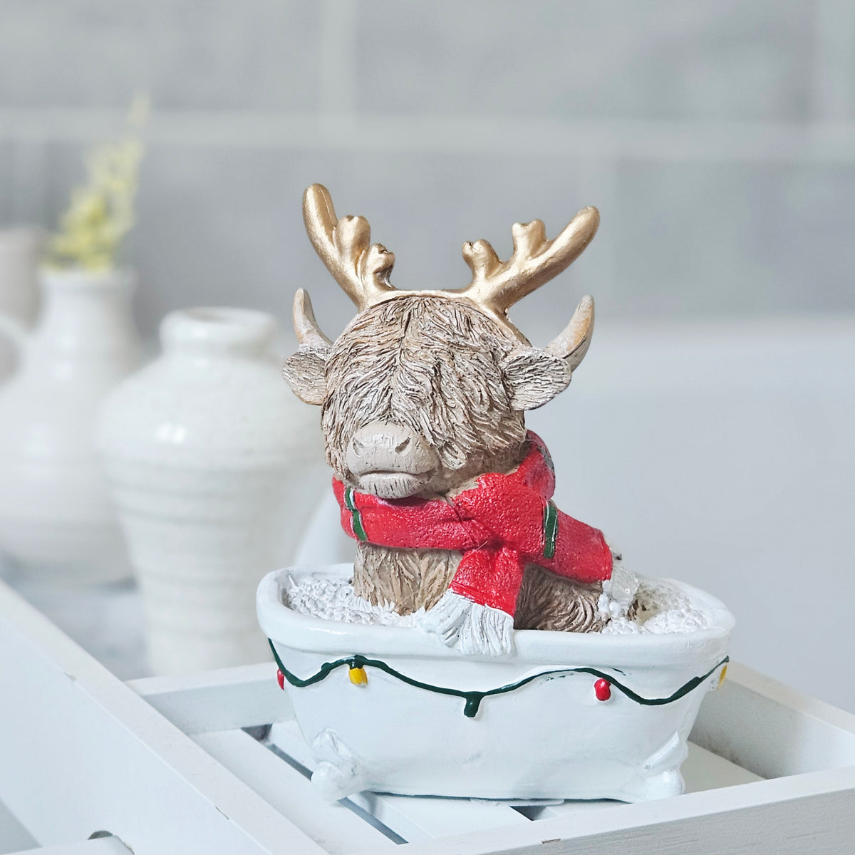 Christmas Highland cow sitting in a bath festive decoration, 14cm
