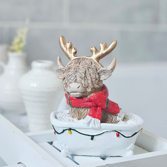 Christmas Highland cow sitting in a bath festive decoration, 14cm