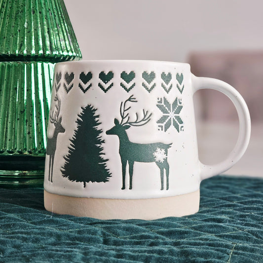 green tapered reindeer mug with motif details