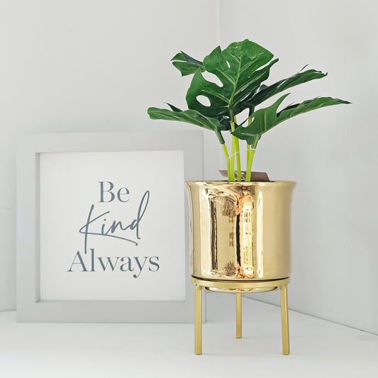 gold footed planter with faux plants 27cm