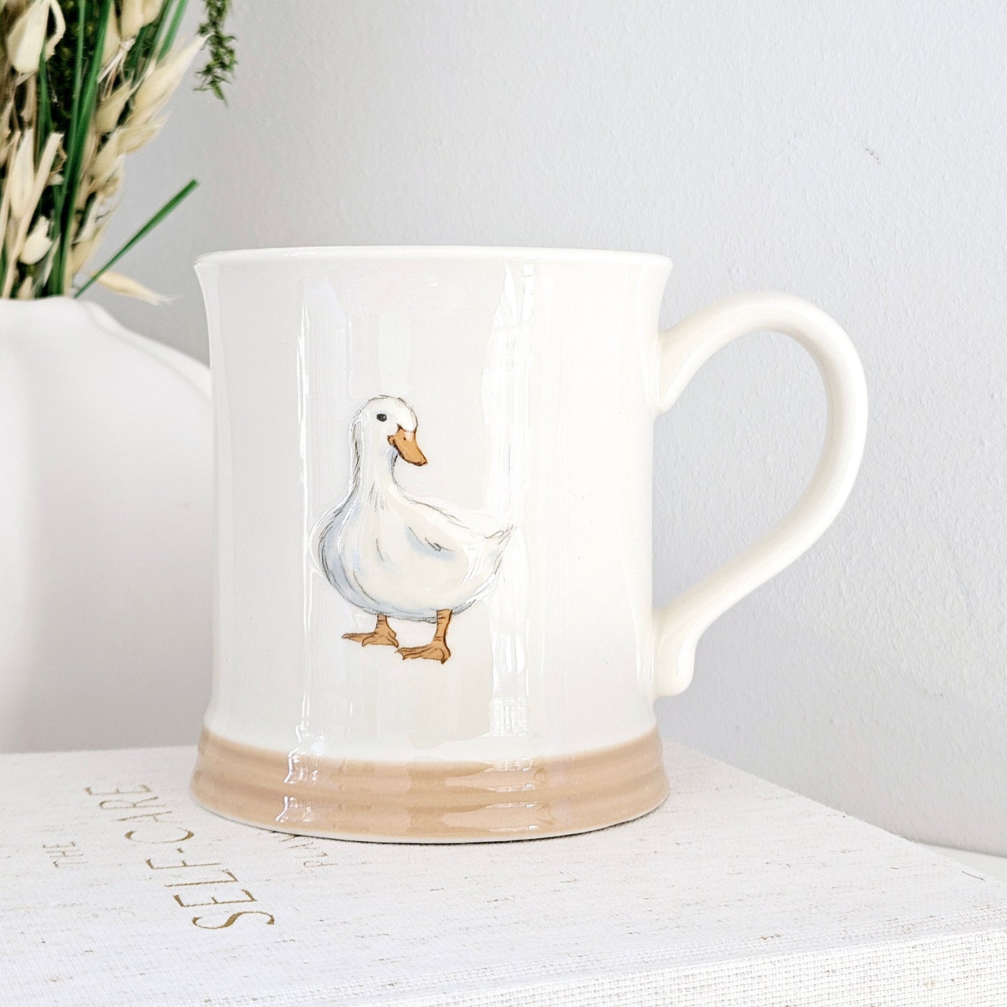 embossed duck mug in white with brown base by country life