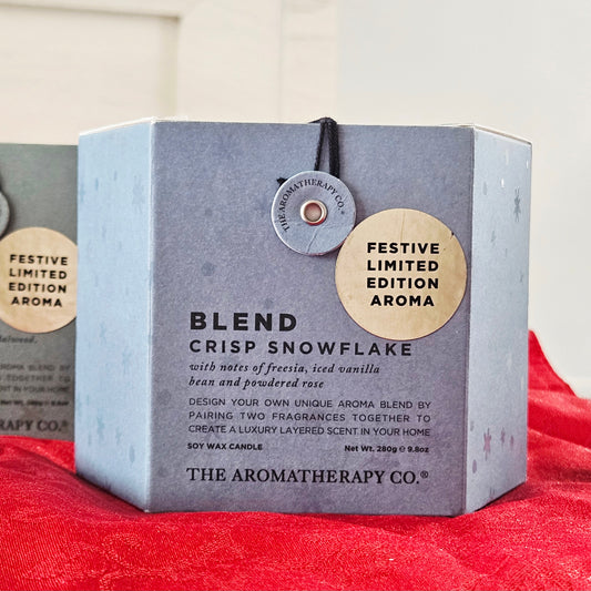 Candle packaging with 'Festive Limited Edition Aroma' label snowflake aromatherapy co blend