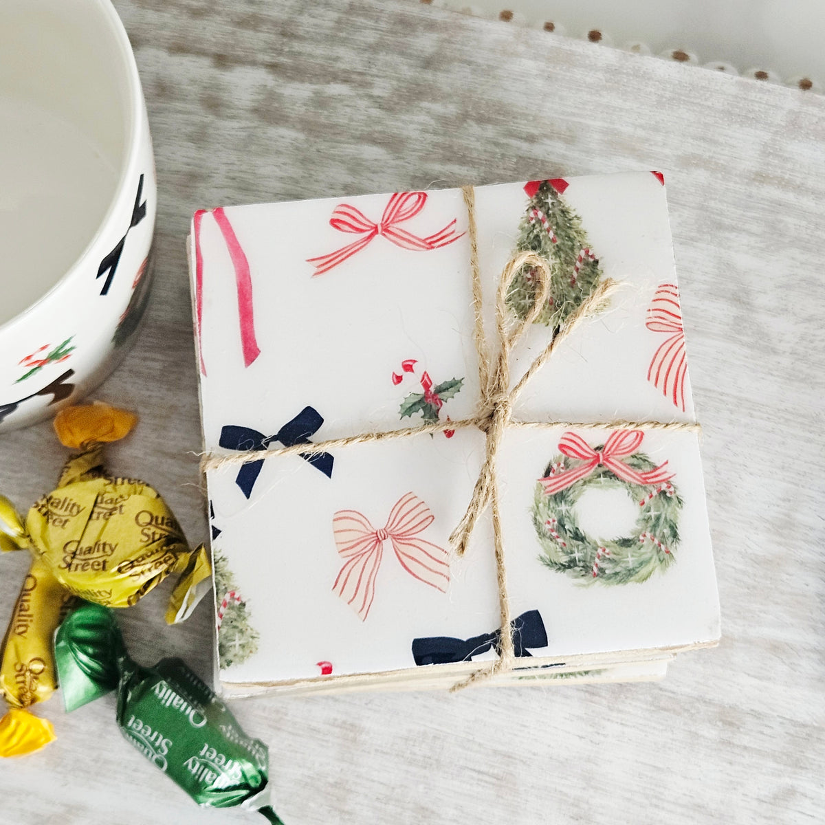 Merry Little Bows repeat pattern mango wood and enamel Christmas coaster set of four