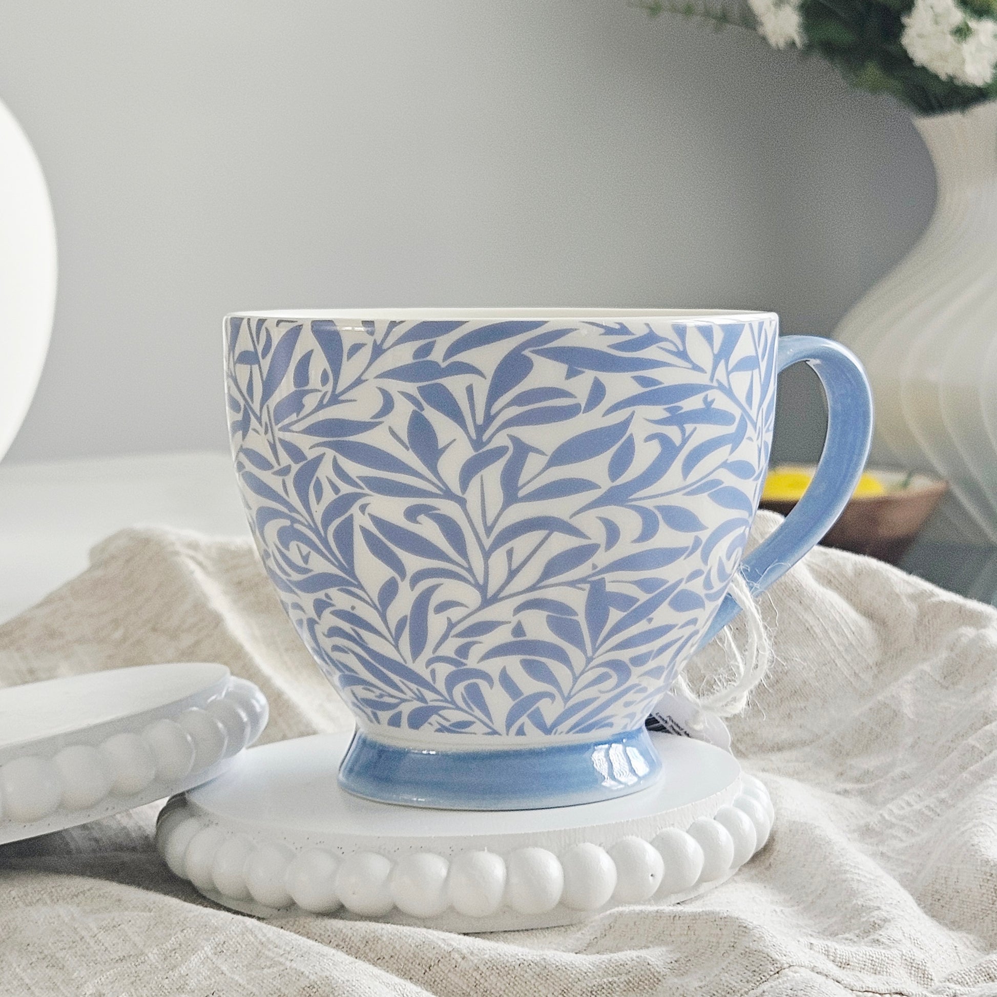 Blue and white patterned leafy trellis mug by Jeff banks home