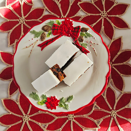 Decorative poinsettia cake stand with floral design and bow