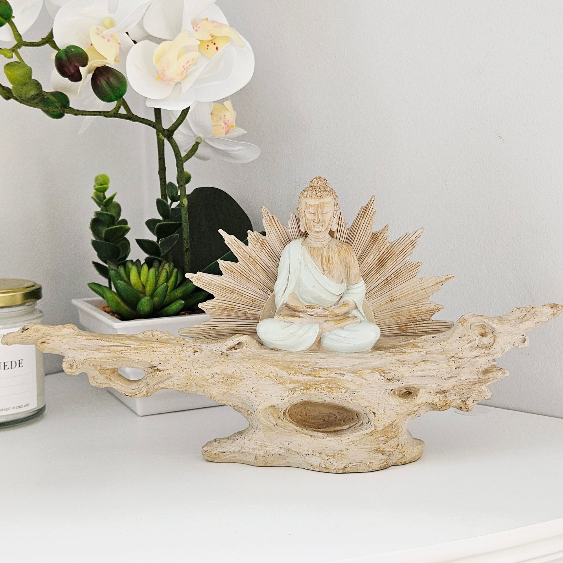 Juliana meditating buddha on a branch 