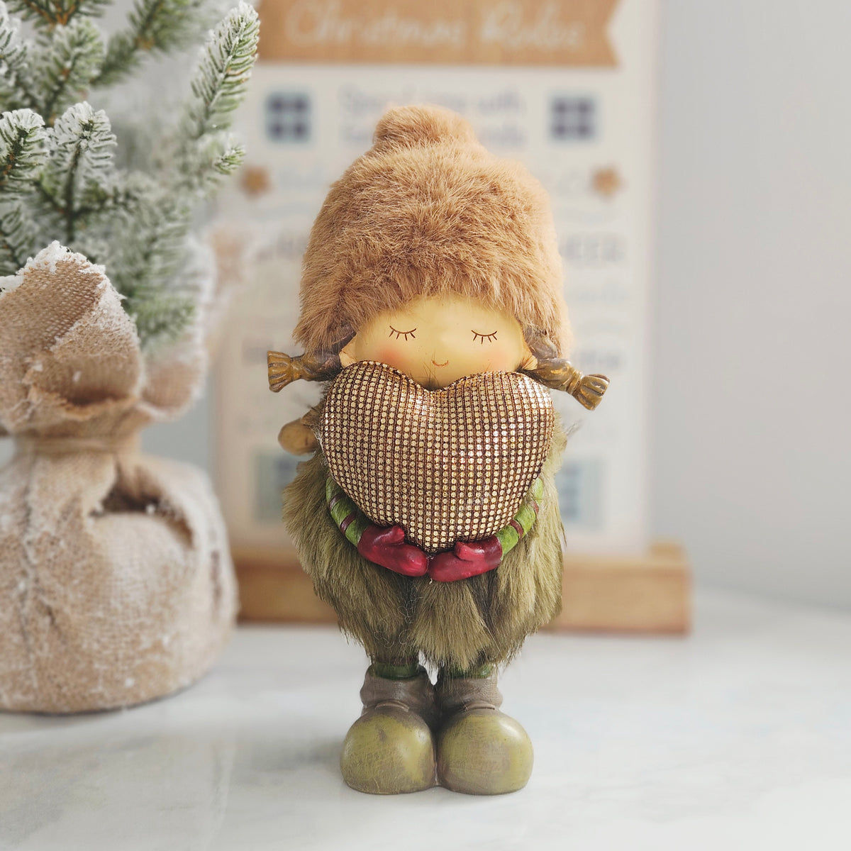 Woodland Noel standing resin girl Christmas ornament with faux fur hat and gold heart