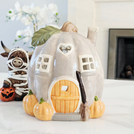 ceramic pumpkin t light house holder with pumpkins orange door and broomstick out front 16cm