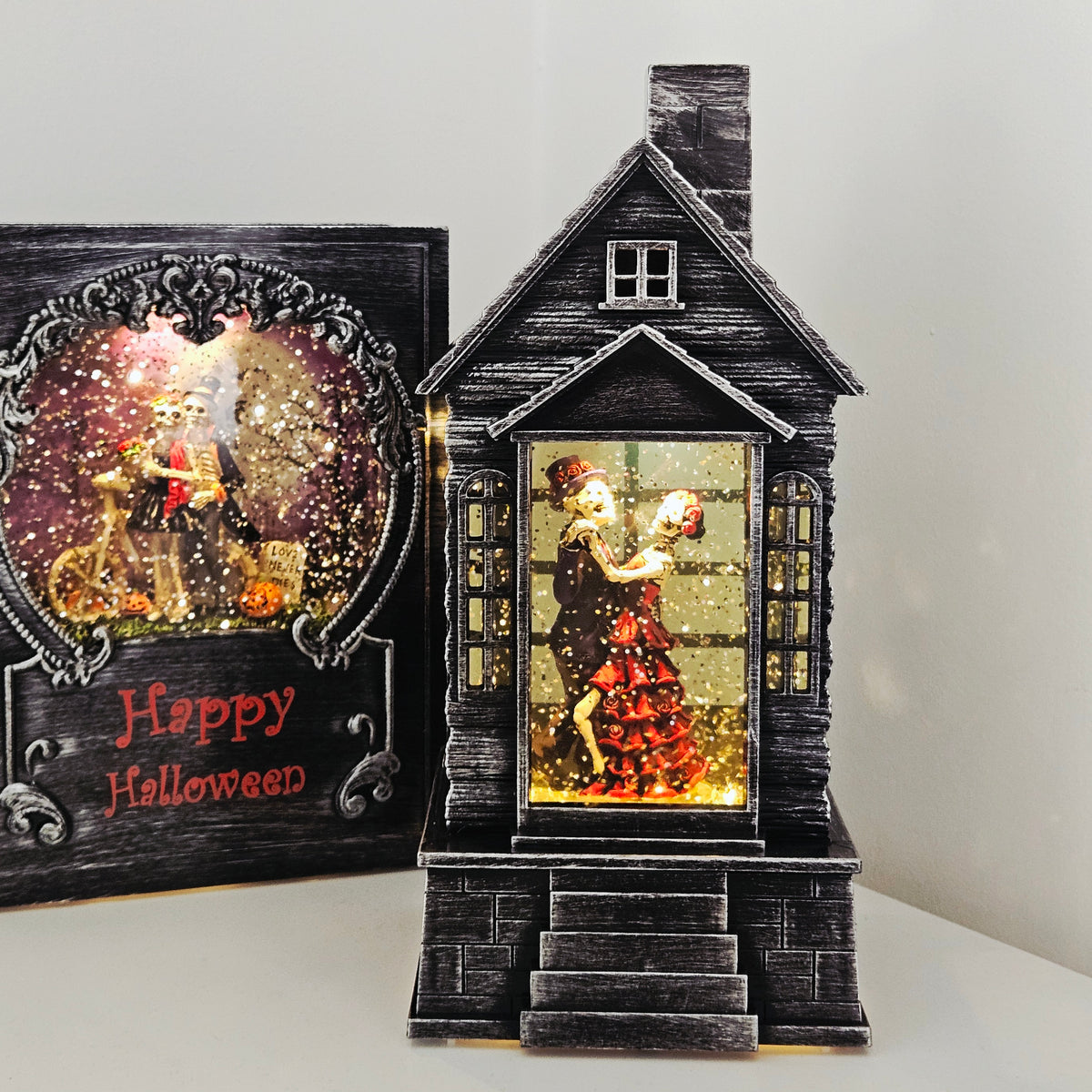 25cm Halloween LED lantern spinner with dancing skeleton couple and sparkling glitter effect