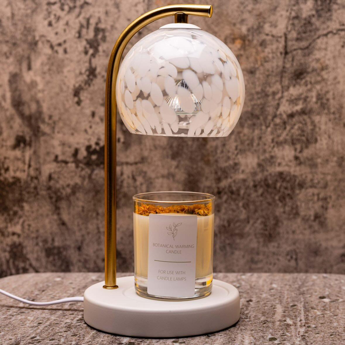 Decorative white confetti candle warmer lamp with gold base and white candle holder base