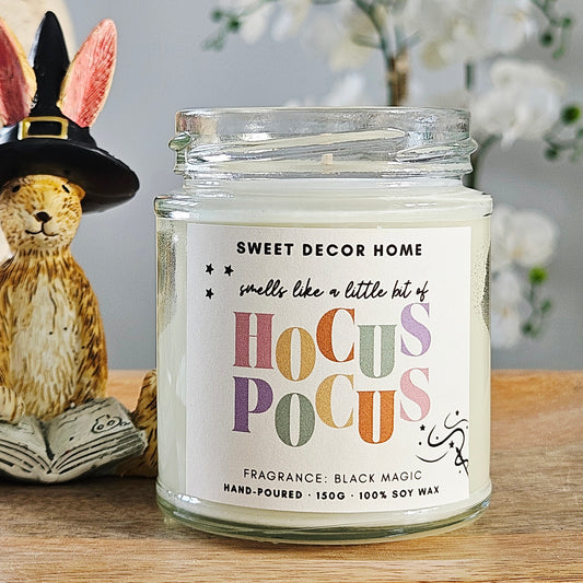 Candle jar labeled 'Sweet Decor Home' with 'Hocus Pocus' label and black magic scent 190ml 100% soy wax