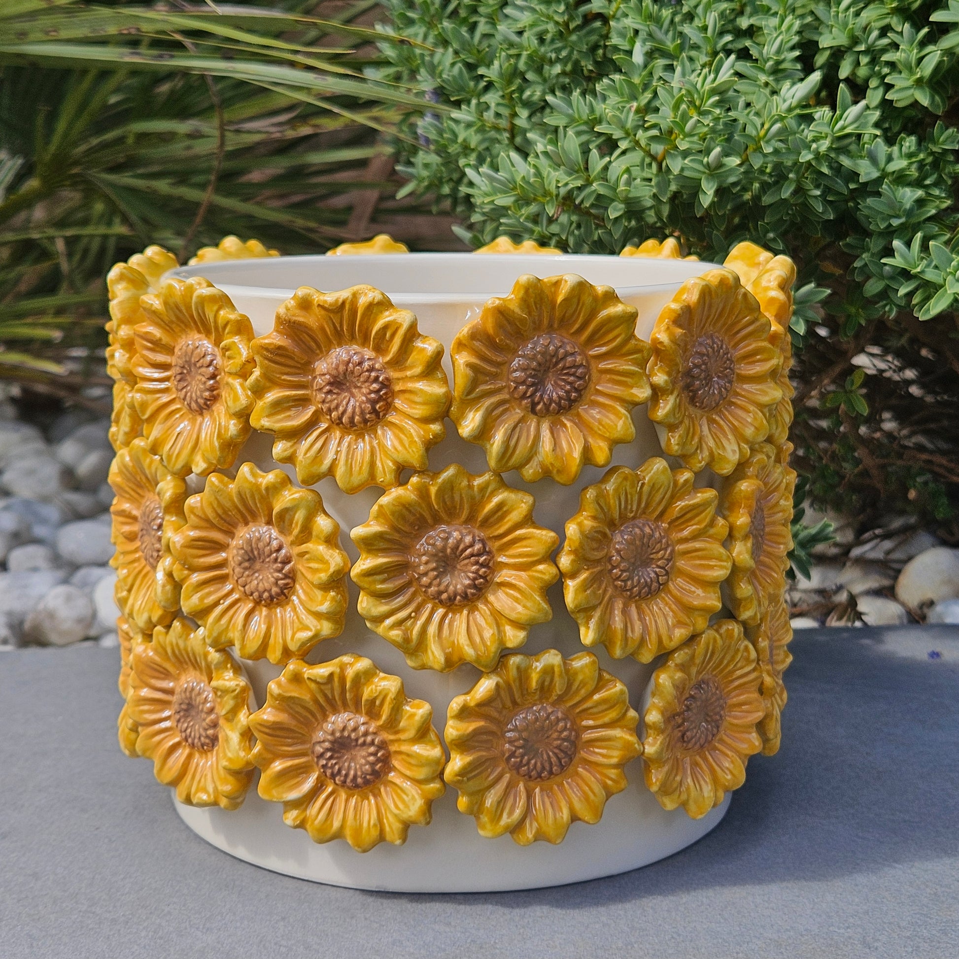 large Decorative planter with yellow 3d sunflower designs on it all the way around