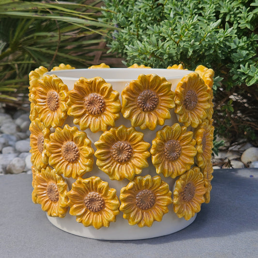 large Decorative planter with yellow 3d sunflower designs on it all the way around