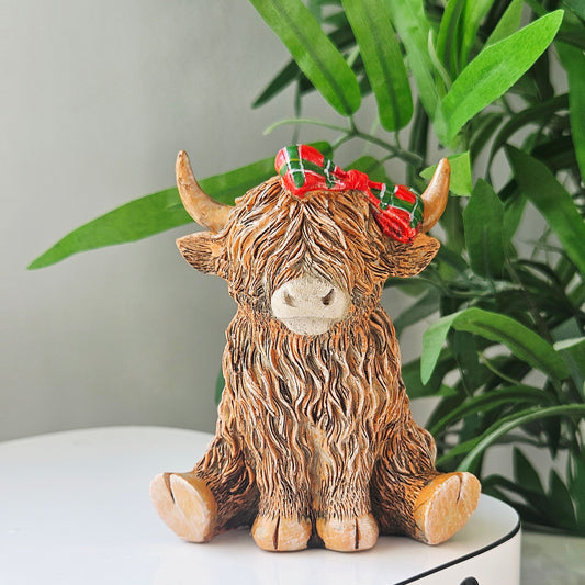 Highland Cow ornament wearing a tartan bow