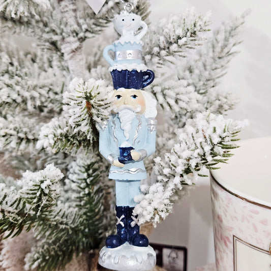 Blue and white nutcracker Christmas tree hanging ornament with teacup hat