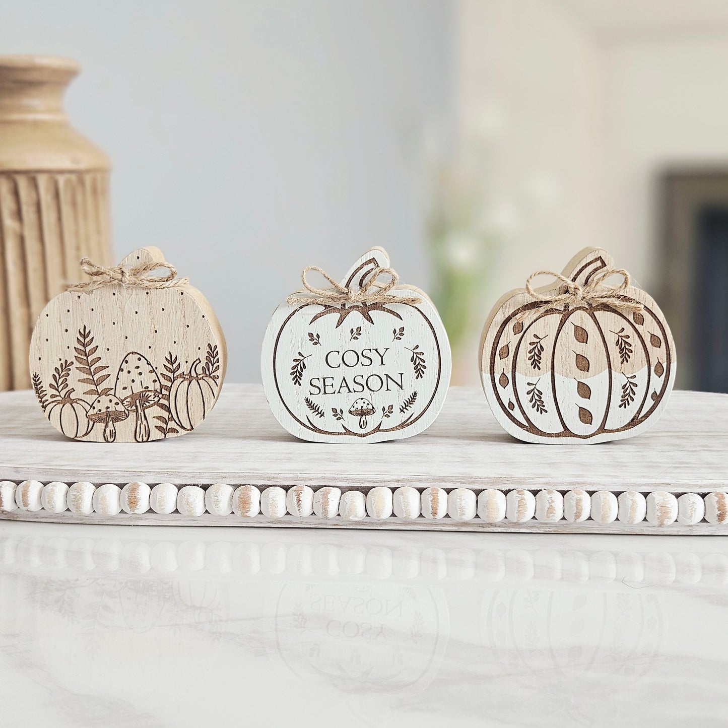 Etched wood shaped pumpkin block in assorted autumn designs, rustic wooden pumpkin decoration for farmhouse fall home décor.