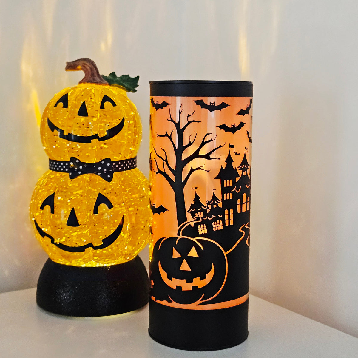 20cm LED Halloween column with orange shooting star light and spooky black silhouettes