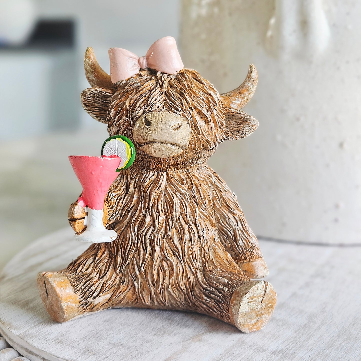 Highland Cow Happy Hour ornament holding a cocktail with pink bow farmhouse resin home decor