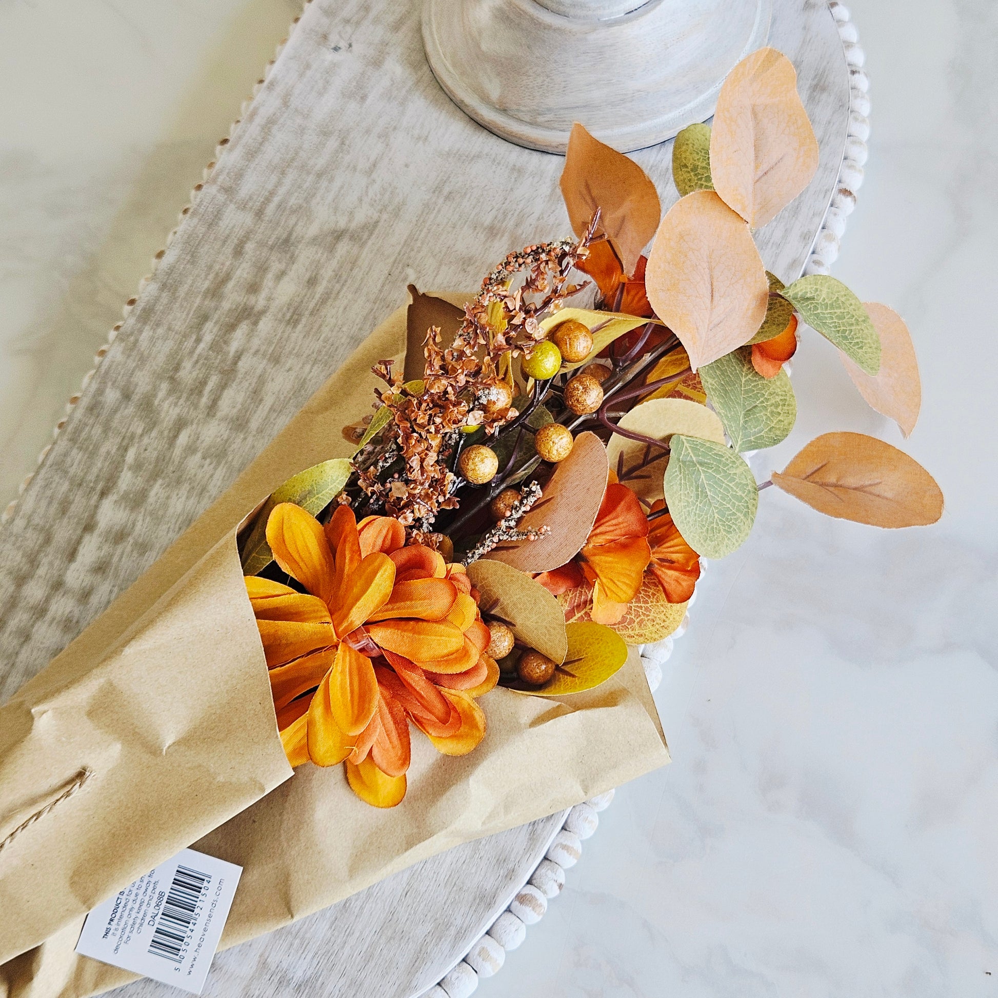 Russet autumnal foliage bouquet with artificial leaves and berries for autumn vase displays and seasonal home décor