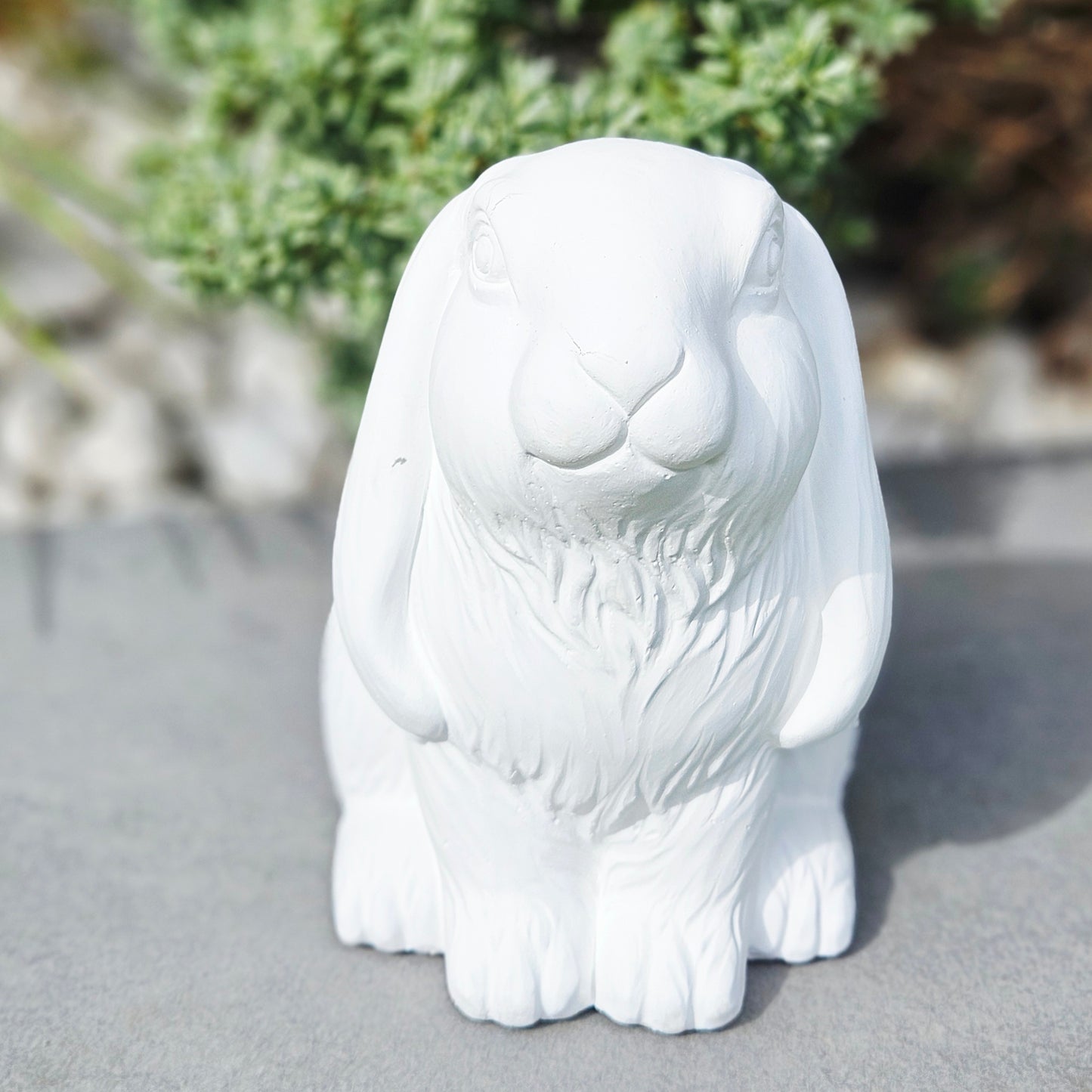 white cement rabbit ornament 