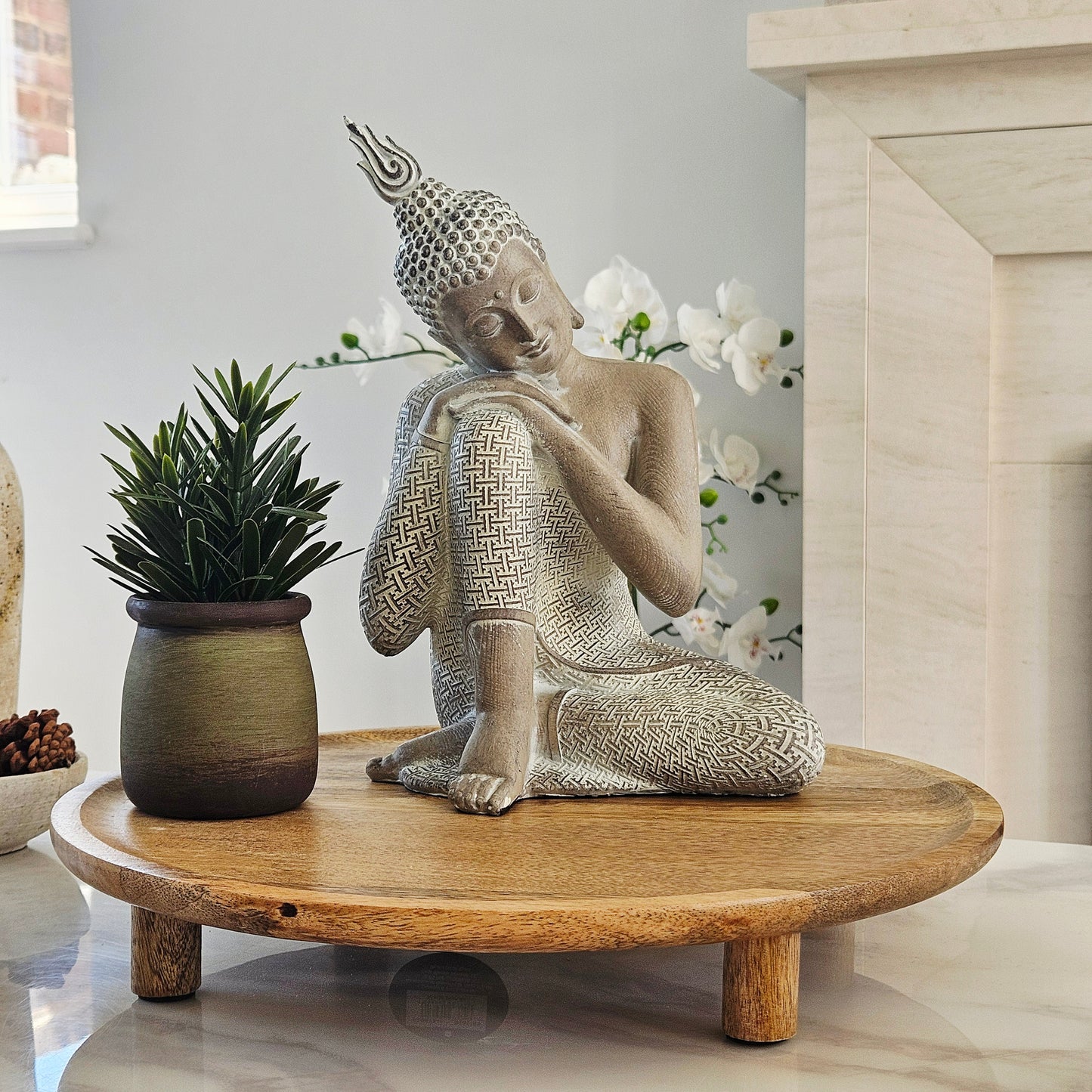 Decorative Buddha statue with intricate patterns 26cm sitting resting head on hands
