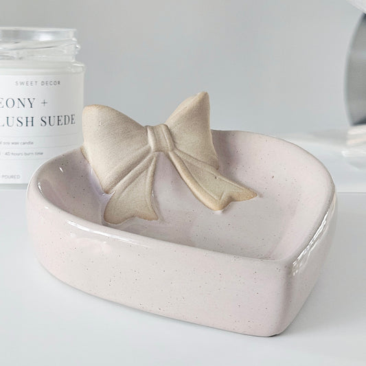 Heart-shaped ceramic dish with a bow design 