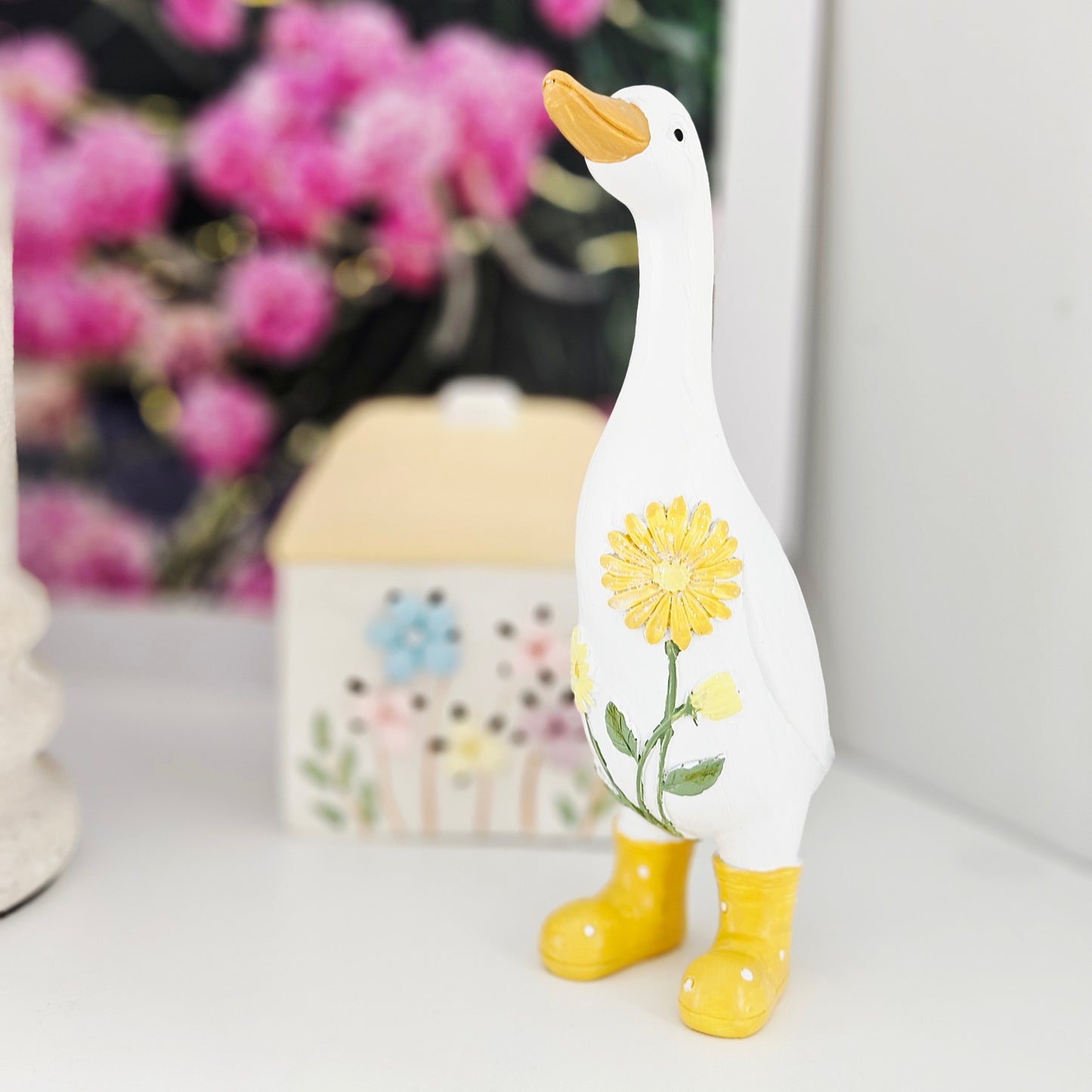 Decorative duck figurine with yellow boots and sunflower design 20cm