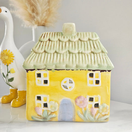 Yellow ceramic house with a thatched roof tea light holder 