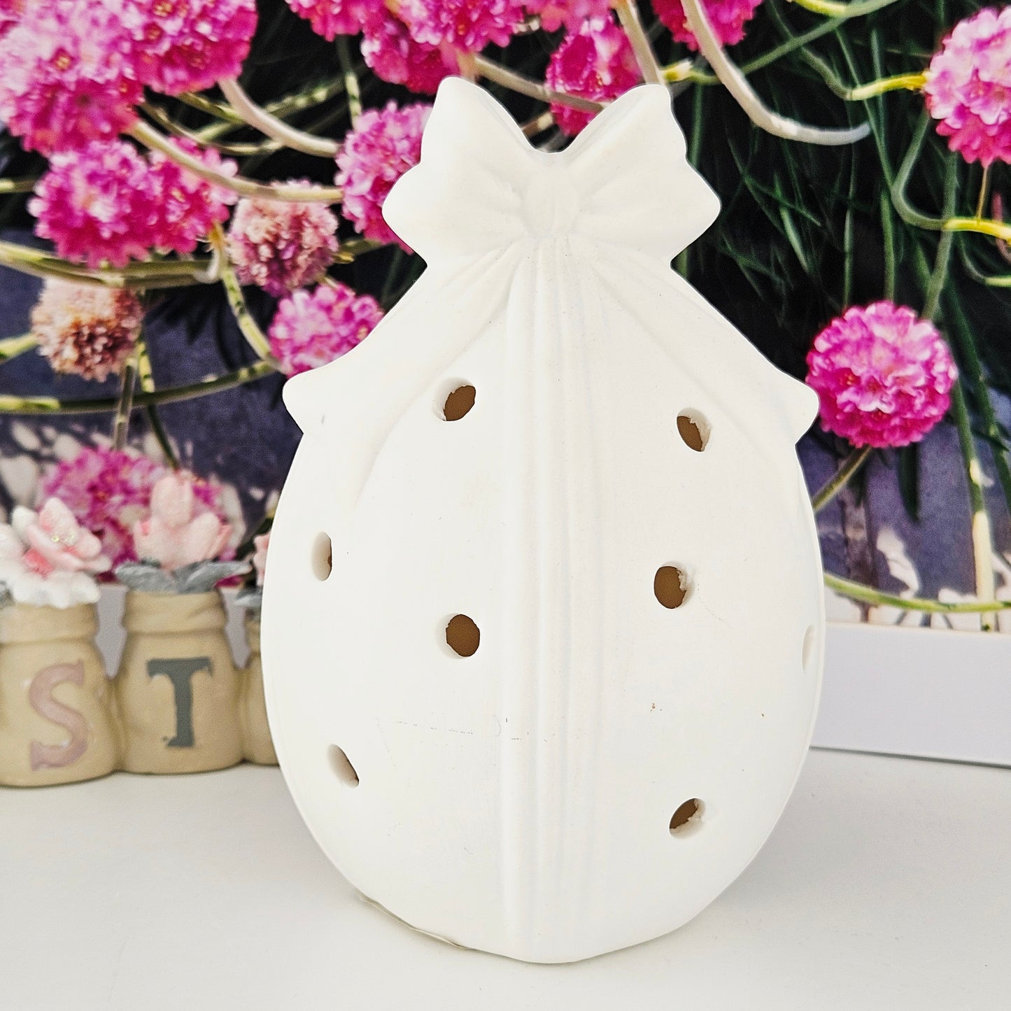 Decorative led lamp shaped like an easter egg and a bow on top,