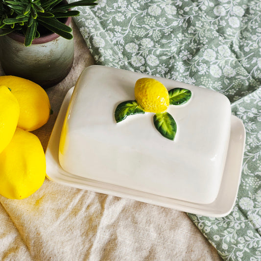 White ceramic butter dish with lemon design on top