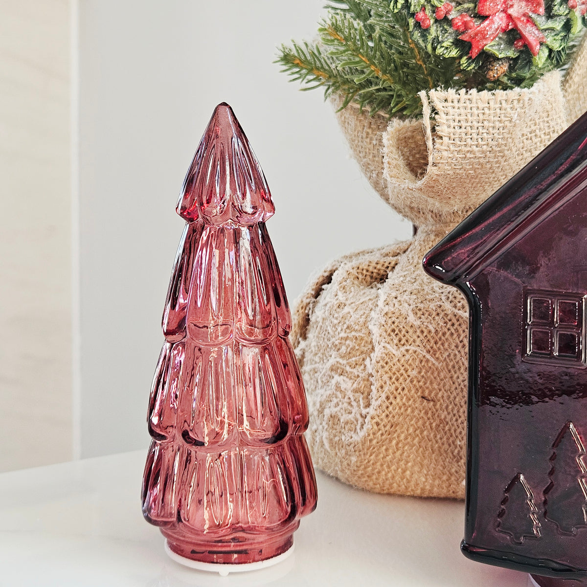 A small ribbed glass led Christmas tree ornament in red  