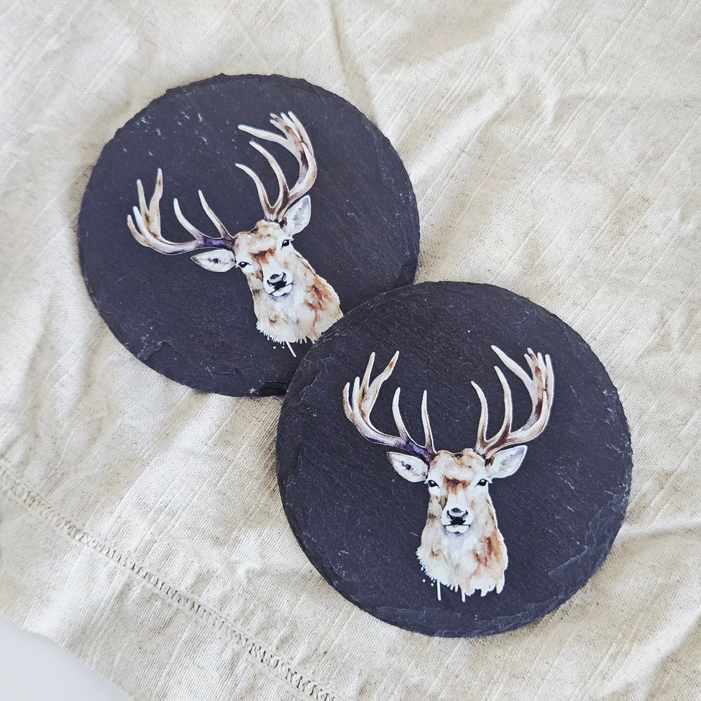 set of 2 slate coasters in black with a stag on the front 
