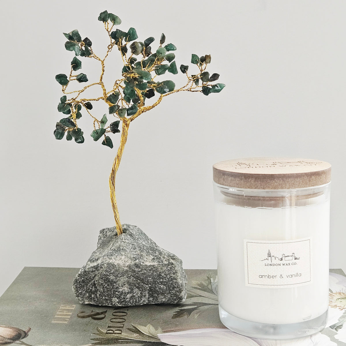 small green gemstone tree with crystal leaves and gold metal branches
