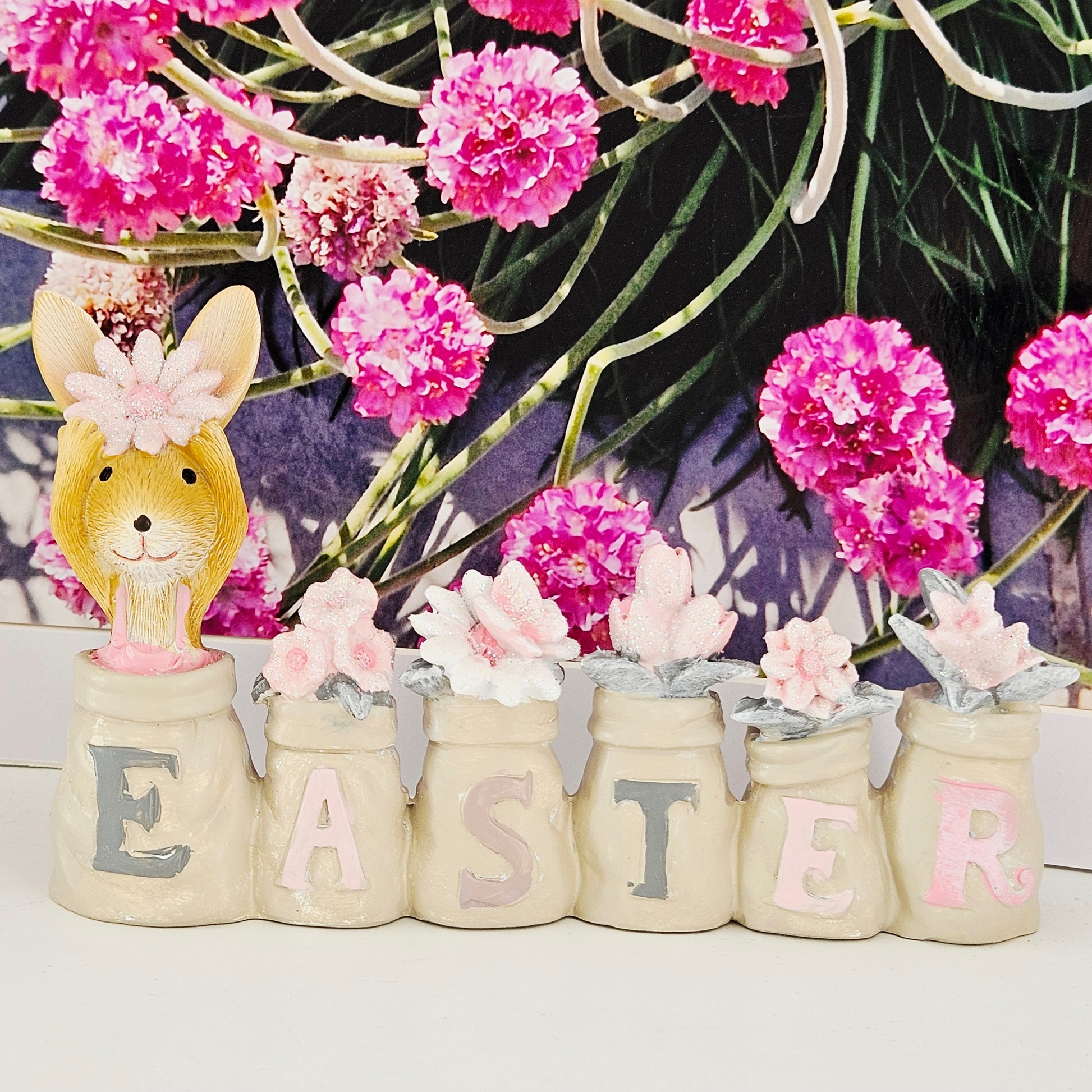 Decorative Easter set with bunny figure and jars spelling 'Easter' 