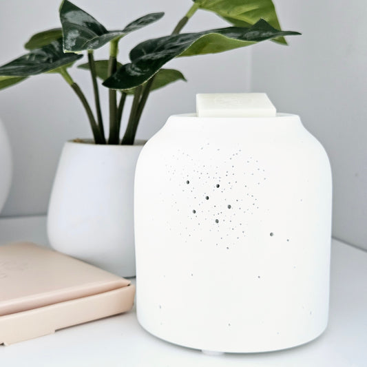 white pin holed ceramic wax and oil burner by hestia