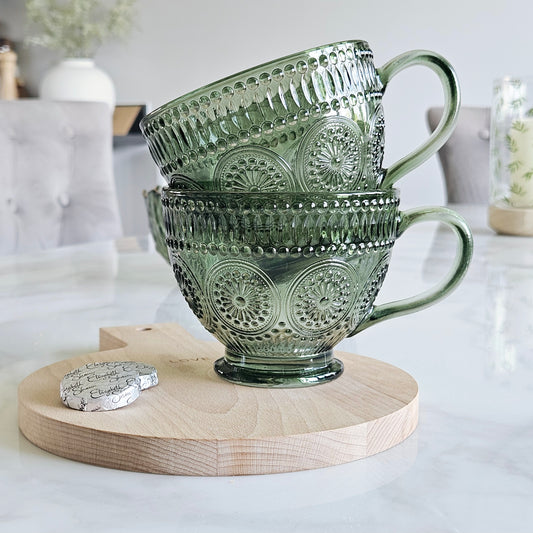 set of two glass green pressed patterned mugs 