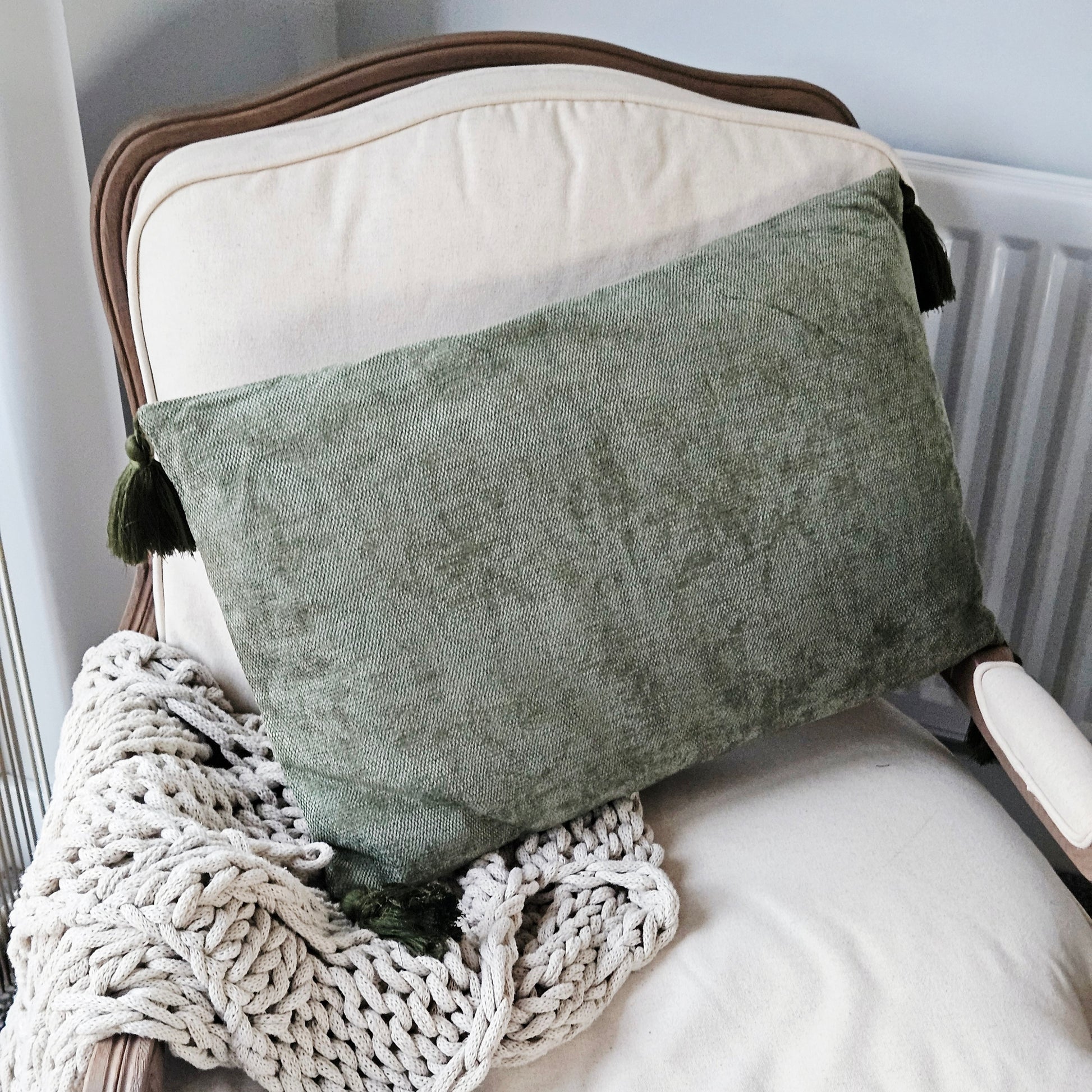 Green tasselled rectangular cushion