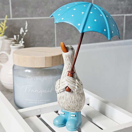 duck ornament 16cm holding a blue spotty umbrella and blue wellies