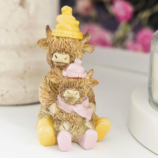 Highland cow resin double raincoat family ornament with two cows wearing matching coats