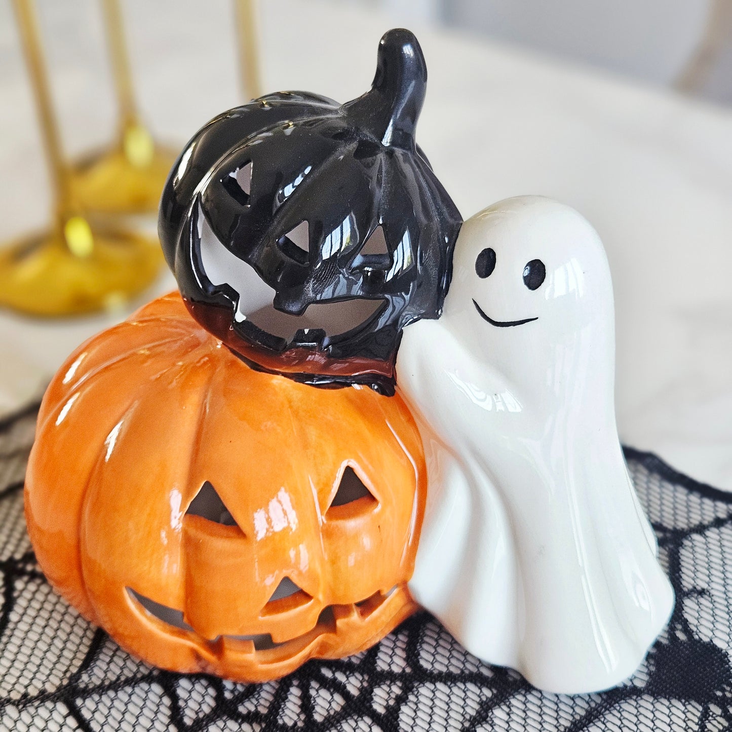 LED ghost Halloween decoration holding a black and orange pumpkin, ideal for spooky seasonal home décor and Halloween displays.